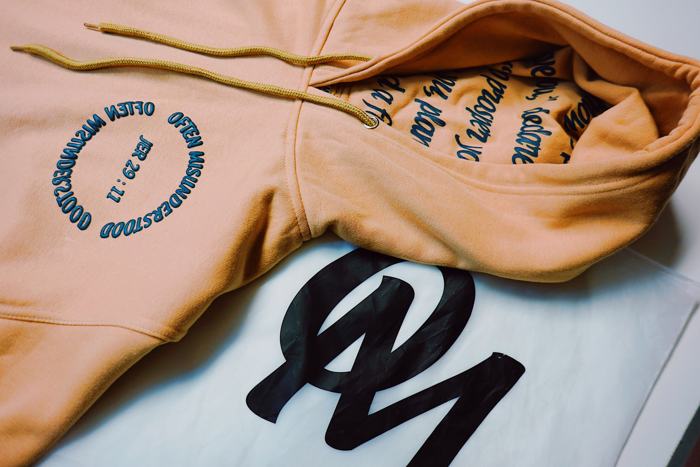 OM “God’s Timing Is the Best Timing” Hoodie – Desert Peach / Teal Puff Print