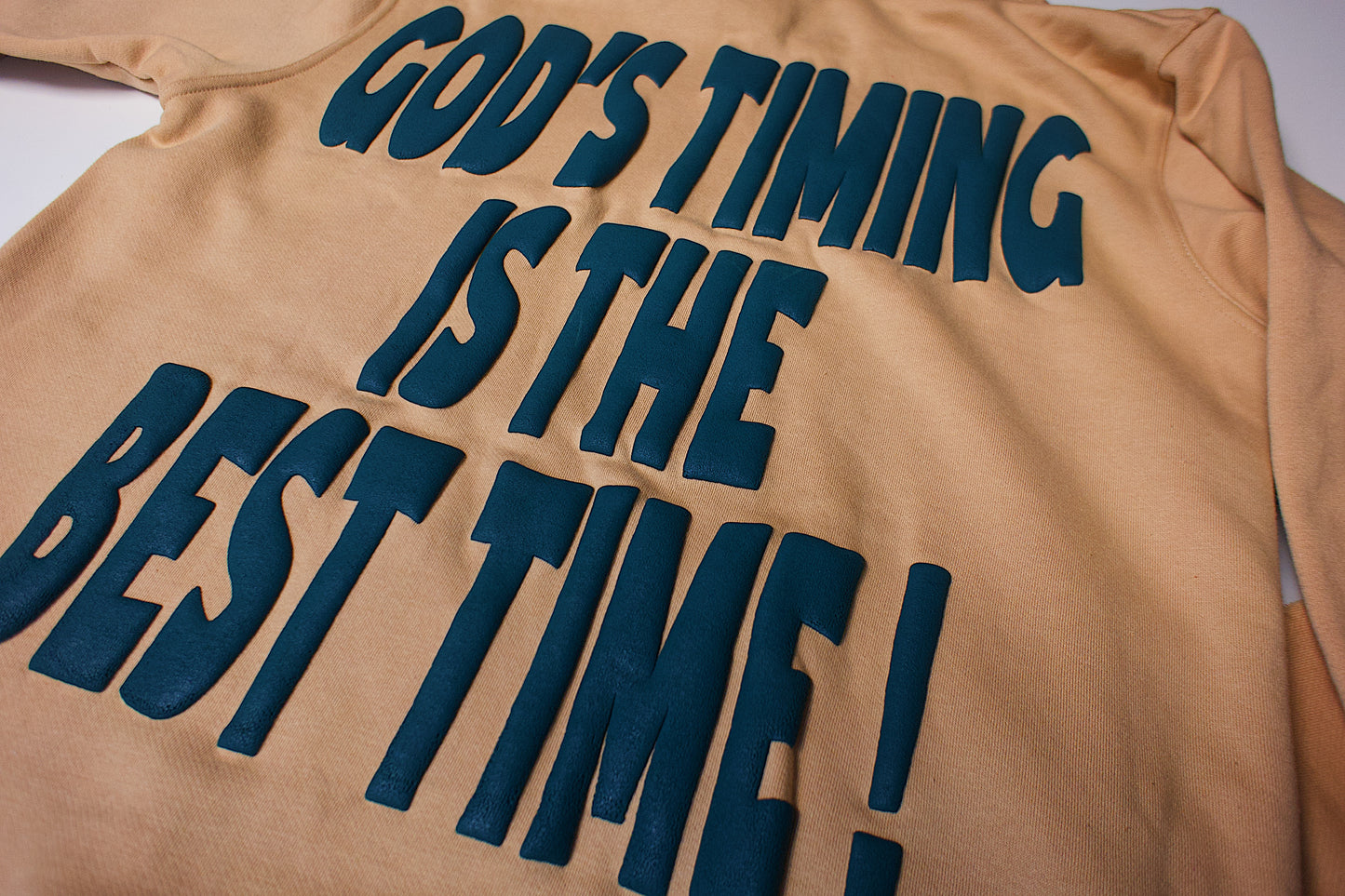 OM “God’s Timing Is the Best Timing” Hoodie – Desert Peach / Teal Puff Print