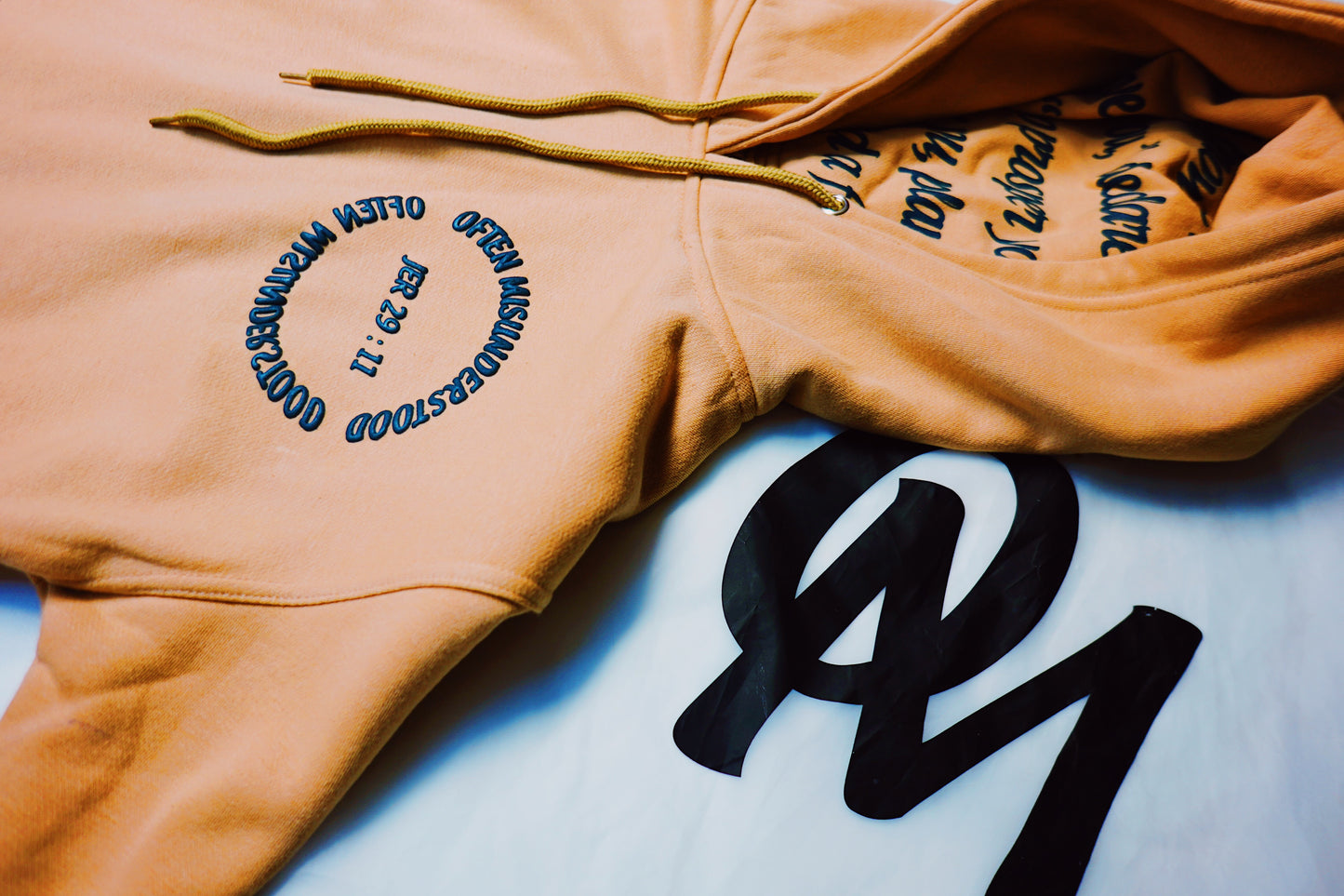OM “God’s Timing Is the Best Timing” Hoodie – Desert Peach / Teal Puff Print