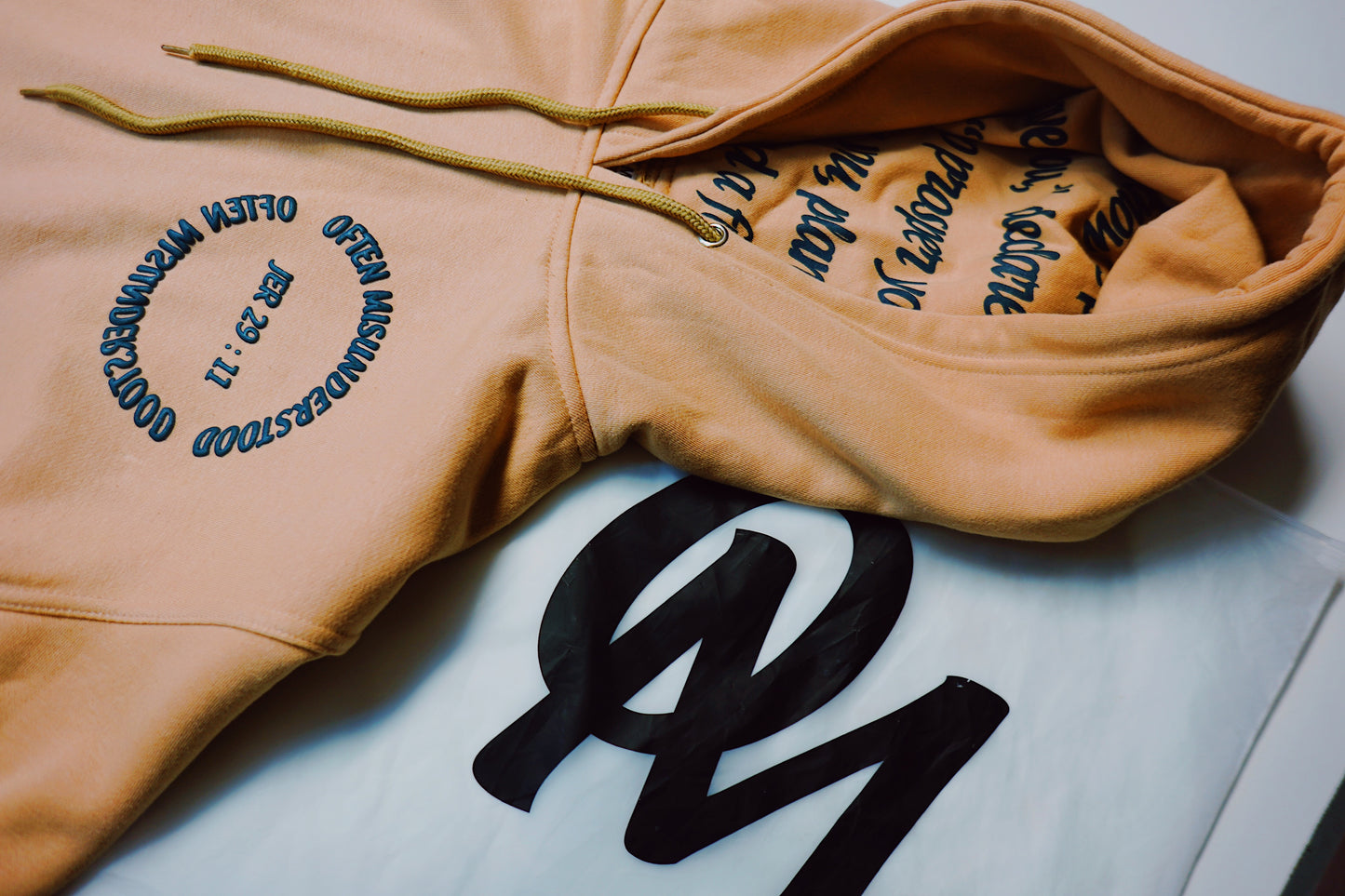OM “God’s Timing Is the Best Timing” Hoodie – Desert Peach / Teal Puff Print